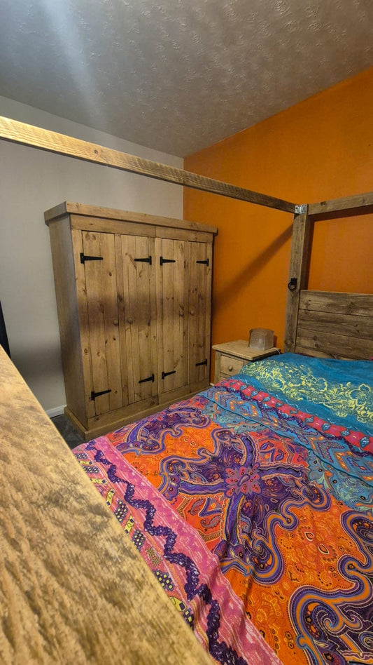 Gordon’s rustic bedroom with Tudor bed, four-door wardrobe and matching bedside