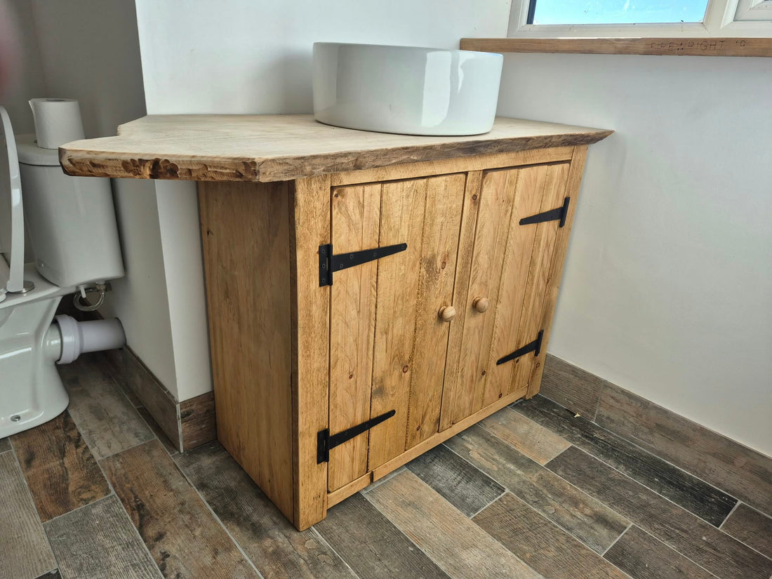 Rustic two door sink cabinet handmade by Three Skulls Furniture, with a timber top made by the customer