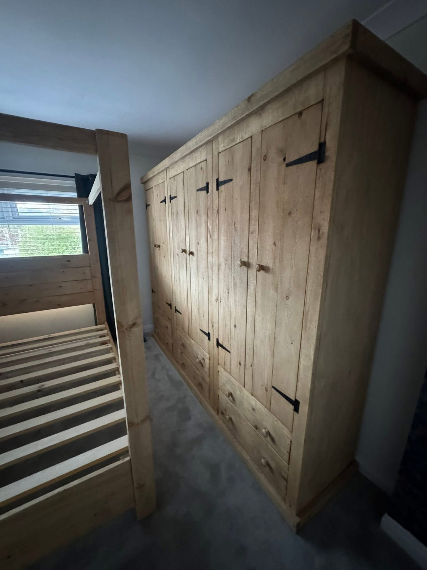 Handmade wooden wardrobe with rustic bedroom styling