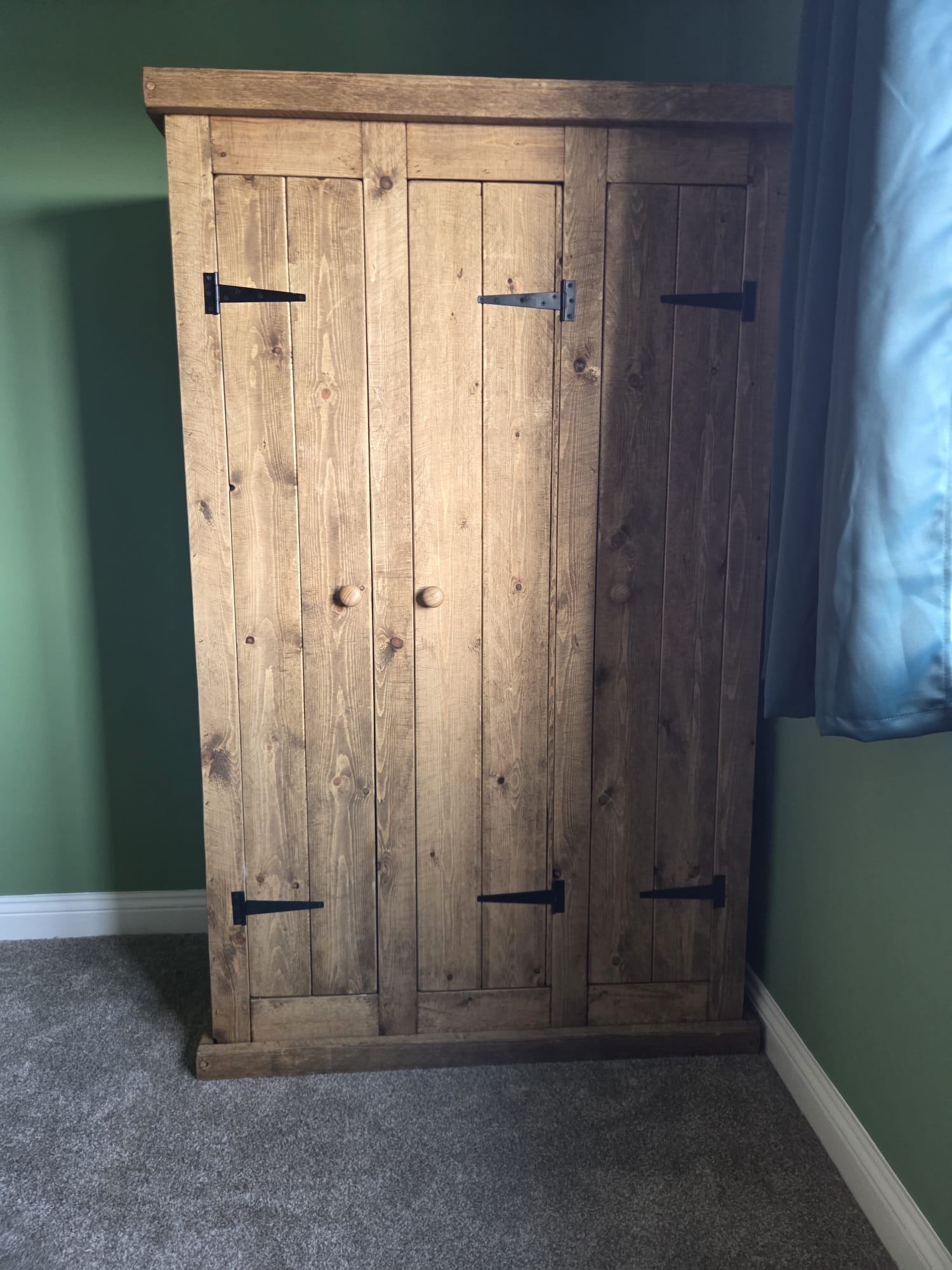 Rustic wooden wardrobe with substantial handmade frame
