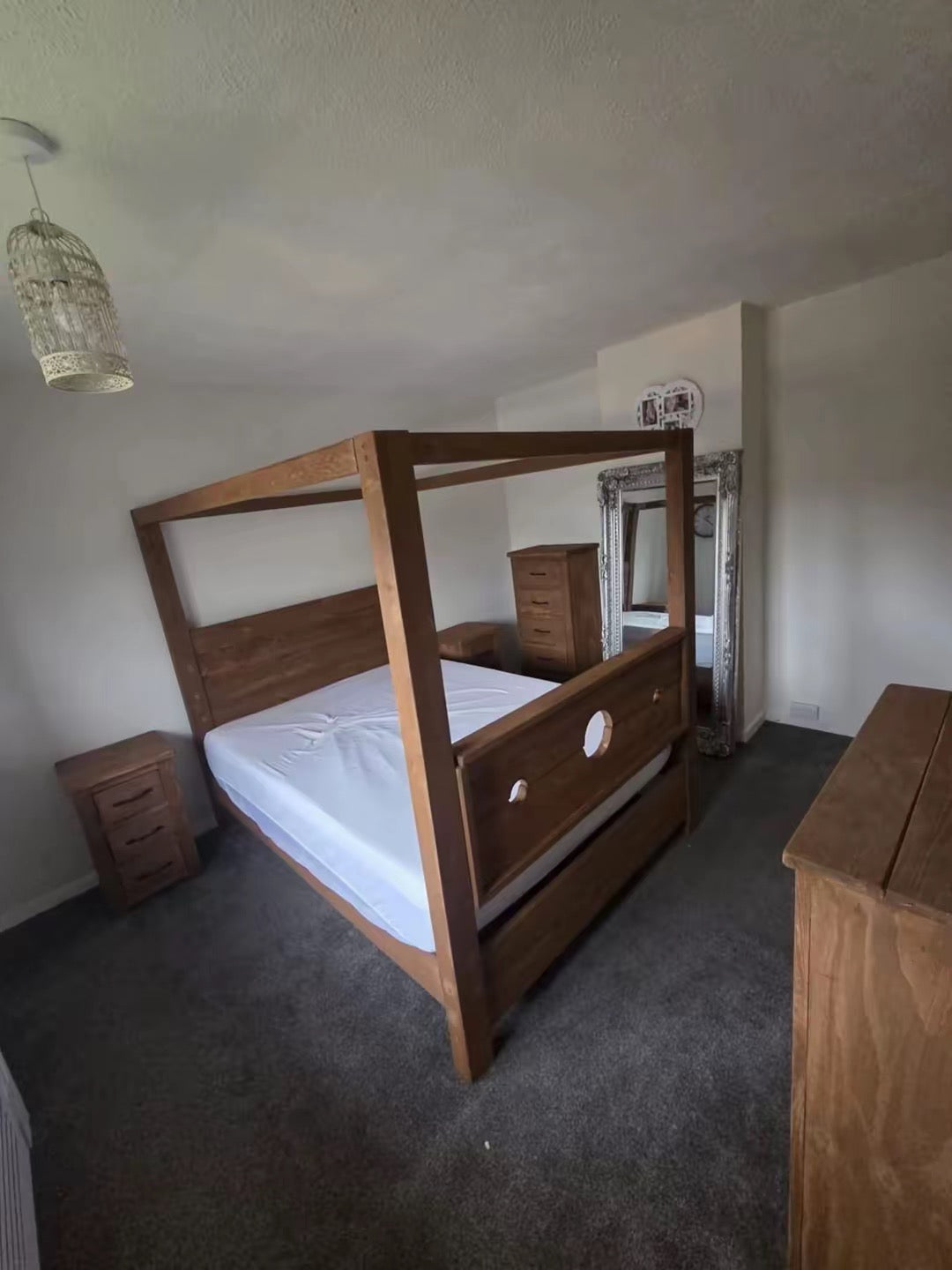 Rustic wooden Tudor statement bed with gothic medieval styling