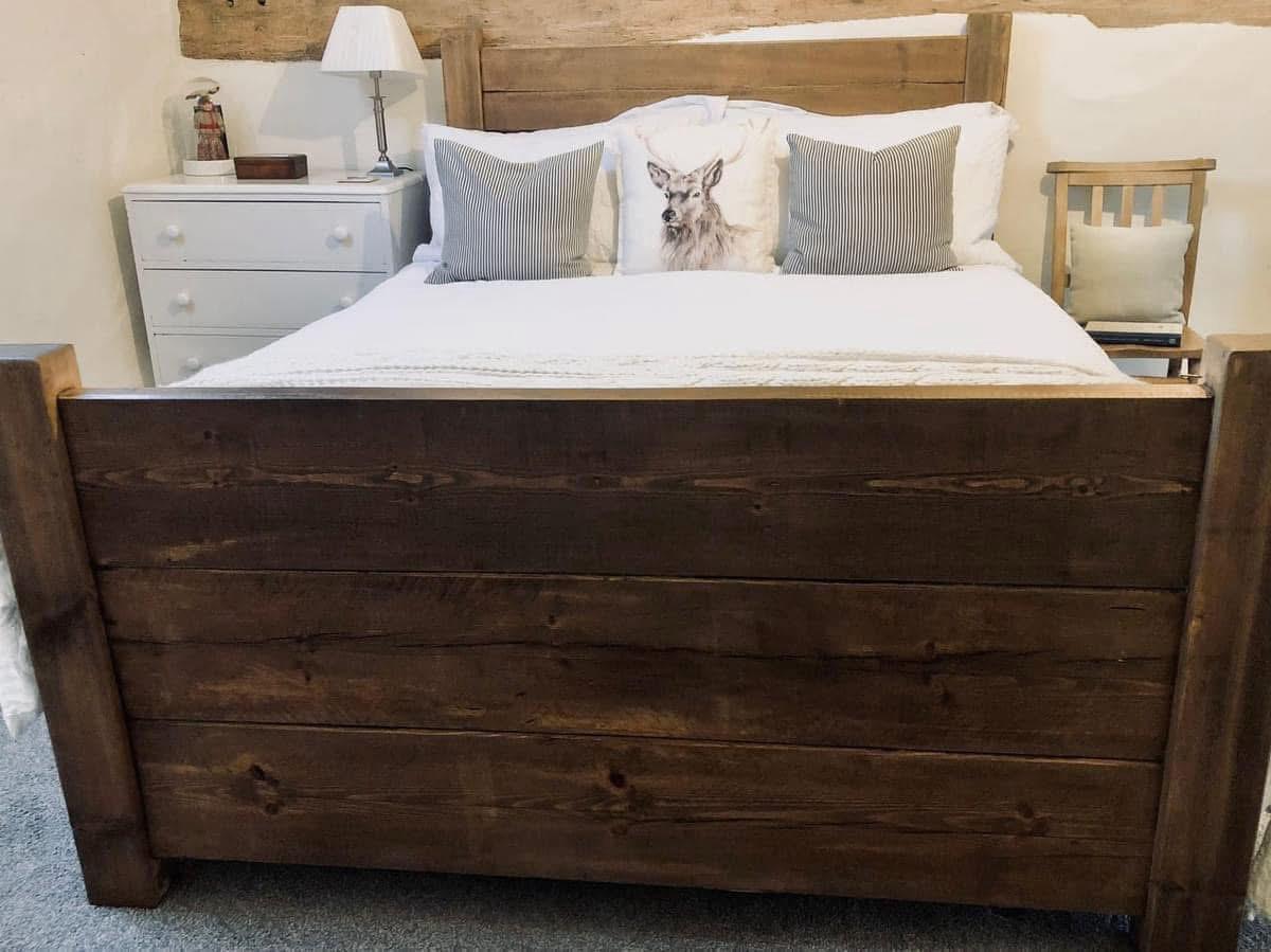 High Plank statement bed with rustic wooden frame