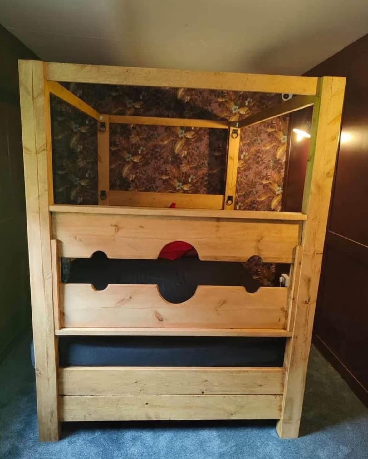 Handmade Tudor medieval wooden statement bed by Three Skulls Furniture