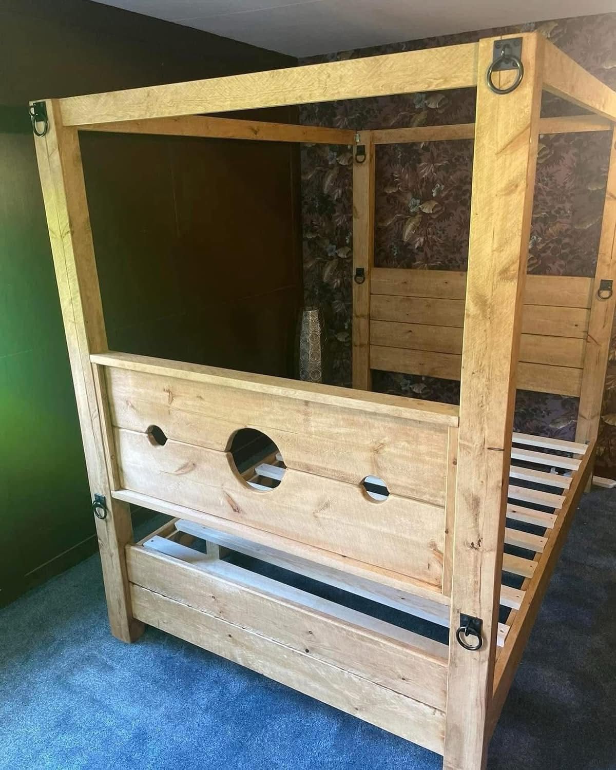 Tudor rustic wooden bed frame with medieval styling and detachable stocks