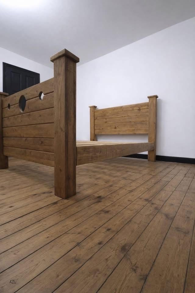 The Jester Bed handmade wooden frame viewed from the side